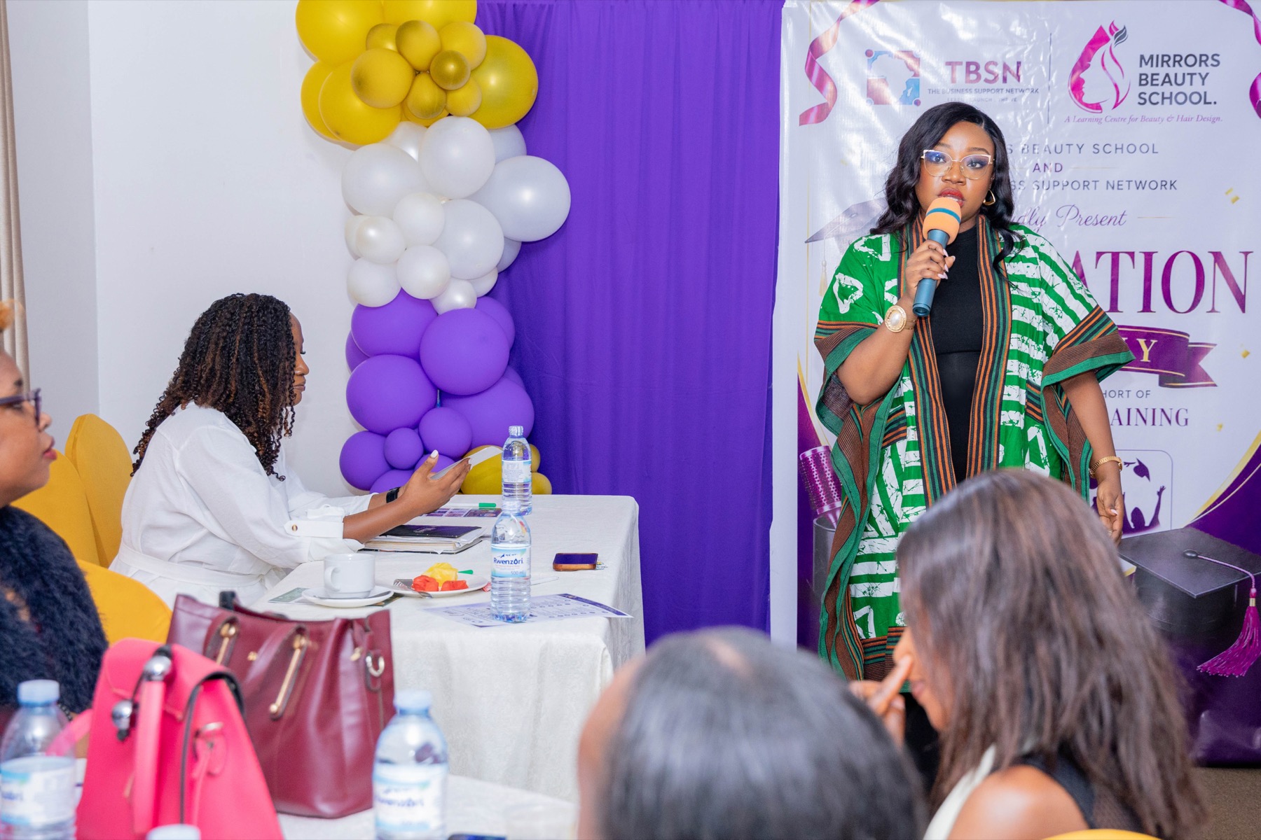A graduate addressing the room